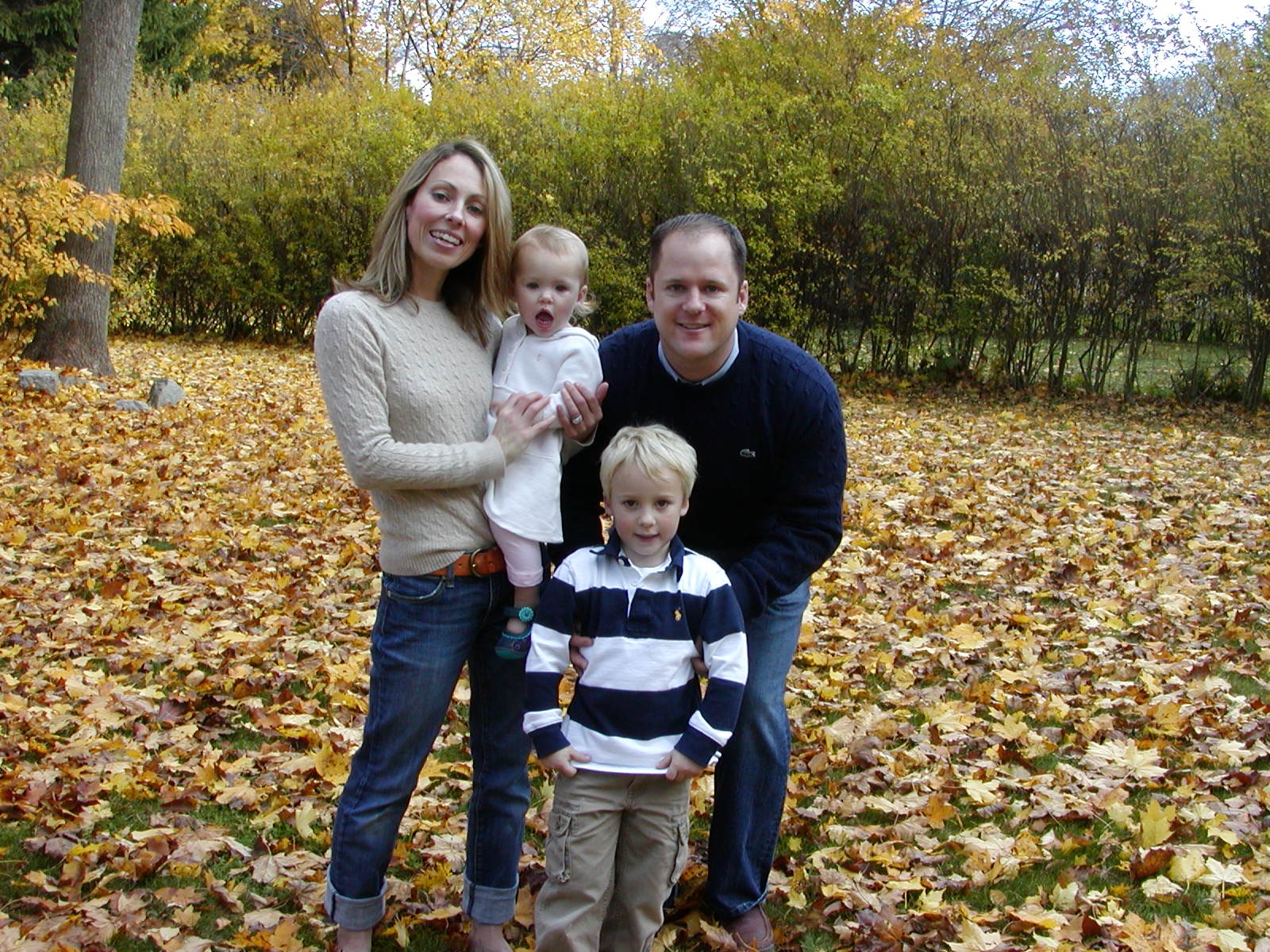 The Mellett family in the backyard · autumn leaves · Tasha + Jimmy + Cole + Annie